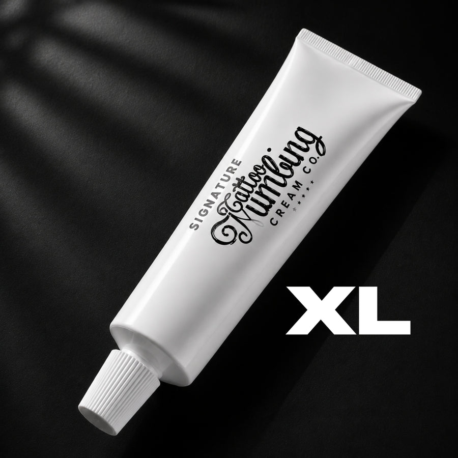 Signature 30g XL tattoo numbing cream in a tattoo studio